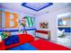Toy Story-themed bedroom featuring two twin beds, character decor, and a decorative ceiling at 8824 Cruden Bay Ct, Davenport, FL 33896