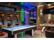Game room with pool table, vintage arcade games, and colorful lighting at 8824 Cruden Bay Ct, Davenport, FL 33896
