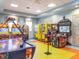 Fun-filled game room featuring a variety of arcade games for entertainment at 8824 Cruden Bay Ct, Davenport, FL 33896