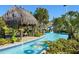 Relaxing lazy river winding through lush tropical landscaping, perfect for unwinding at 8824 Cruden Bay Ct, Davenport, FL 33896