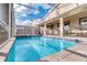 Screened pool with clear blue water and sunny patio area at 8824 Cruden Bay Ct, Davenport, FL 33896