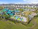 Community water park featuring slides, play areas, a lazy river and many seating areas at 8824 Cruden Bay Ct, Davenport, FL 33896