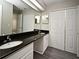 Bathroom with a double sink vanity and a big mirror at 940 Douglas Ave # 170, Altamonte Springs, FL 32714