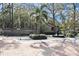 Community entrance with brick-paved roundabout, water fountain and signage landscaped with manicured shrubs at 940 Douglas Ave # 170, Altamonte Springs, FL 32714