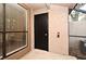 Enclosed door with a window in the area of the entryway featuring a beige textured wall and terrazzo floors at 940 Douglas Ave # 170, Altamonte Springs, FL 32714