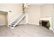 Bright living room features a staircase, fireplace, and neutral decor, creating a warm and inviting space at 940 Douglas Ave # 170, Altamonte Springs, FL 32714