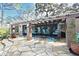 Outdoor patio area with stone floor, pergola, and charming high top seating at 940 Douglas Ave # 170, Altamonte Springs, FL 32714