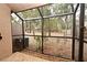 Screened-in porch with views of the backyard and mature trees at 940 Douglas Ave # 170, Altamonte Springs, FL 32714