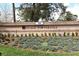 Community sign with the address over a manicured landscape with flowers and shrubbery at 940 Douglas Ave # 170, Altamonte Springs, FL 32714