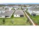 Aerial view of the home highlighting the large backyard, screened patio and neighborhood at 9542 Beautiful Way, Winter Garden, FL 34787