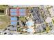 Overhead view of tennis courts, basketball courts, community pool, and covered picnic area with lounge chairs at 10209 Henbury St, Orlando, FL 32832