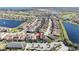 Aerial view of a large community surrounding lakes and a golf course with lush green landscaping at 10209 Henbury St, Orlando, FL 32832