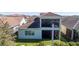 An aerial view of the back of a home with a covered patio and fenced-in yard at 10209 Henbury St, Orlando, FL 32832