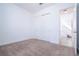 Spacious bedroom with plush carpeting and a large closet, offering comfort and ample storage at 10209 Henbury St, Orlando, FL 32832