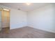 Bedroom with plush carpeting, neutral walls, and a closet, offering a serene living space at 10209 Henbury St, Orlando, FL 32832