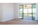 Bright bedroom featuring a large sliding glass door leading to the outdoor balcony at 10209 Henbury St, Orlando, FL 32832