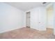 Bedroom with closet, carpeted floors, neutral walls, and ample space for relaxation and personalization at 10209 Henbury St, Orlando, FL 32832