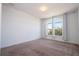 Bedroom featuring a large window with arched transom allowing for plentiful natural light at 10209 Henbury St, Orlando, FL 32832