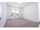 Bright bedroom featuring a large window with arched transom allowing for plentiful natural light at 10209 Henbury St, Orlando, FL 32832
