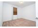 Bedroom with a window with a shade, carpeted flooring, and neutral colored walls at 10209 Henbury St, Orlando, FL 32832