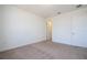 Bedroom with plush carpeting, neutral walls, and a closet, offering a serene living space at 10209 Henbury St, Orlando, FL 32832