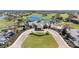 Exterior aerial of clubhouse on a golf course, including parking, putting green and lake at 10209 Henbury St, Orlando, FL 32832