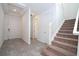 Bright entryway features neutral tile floors, stairway access, and white trim at 10209 Henbury St, Orlando, FL 32832