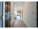 Open entryway with neutral tile flooring and a view of the bright living spaces at 10209 Henbury St, Orlando, FL 32832