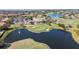 High angle view of golf course and clubhouse with a pond and fountain in a residential community at 10209 Henbury St, Orlando, FL 32832