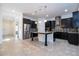 Modern kitchen featuring an island with pendant lighting and stainless steel appliances at 10209 Henbury St, Orlando, FL 32832