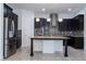 Modern kitchen featuring stainless steel appliances, an island, and pendant lighting at 10209 Henbury St, Orlando, FL 32832