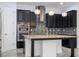 Kitchen featuring an island, stainless steel appliances, and a mosaic backsplash at 10209 Henbury St, Orlando, FL 32832