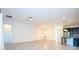 Bright open-concept living area with large windows and tile flooring at 10209 Henbury St, Orlando, FL 32832