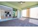 Covered patio with brick floors, ceiling fan, and sliding glass doors leading to the living area at 10209 Henbury St, Orlando, FL 32832