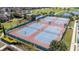 Aerial view of the community tennis courts with multiple courts and manicured landscaping at 10209 Henbury St, Orlando, FL 32832