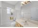 Bright bathroom featuring a tub and shower combination, sink, and toilet at 1203 Gatwick Loop, Lake Mary, FL 32746