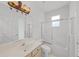 Bright bathroom featuring a tub and shower combination, sink, and toilet at 1203 Gatwick Loop, Lake Mary, FL 32746