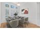 Formal dining room with a high ceiling, many windows, and a modern table and chair set at 1203 Gatwick Loop, Lake Mary, FL 32746