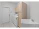 Functional laundry room with washer, dryer, sink, and cabinet storage at 1203 Gatwick Loop, Lake Mary, FL 32746