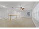 Spacious loft with neutral carpet, railing, ceiling fan and natural light at 1203 Gatwick Loop, Lake Mary, FL 32746