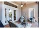 Screened patio features comfortable seating, ceiling fan, and access to the home's interior at 1203 Gatwick Loop, Lake Mary, FL 32746