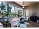 Screened patio featuring a ceiling fan, patio furniture, and view of backyard at 1203 Gatwick Loop, Lake Mary, FL 32746