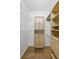Walk-in closet with hanging rods, adjustable shelves, and built in cabinet and drawers at 1203 Gatwick Loop, Lake Mary, FL 32746