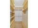 Walk-in closet with built-in shelving and drawers for ample storage space at 1203 Gatwick Loop, Lake Mary, FL 32746
