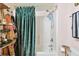 Bathroom featuring stylish decor, gold fixtures, and a shower with curtain at 125 E Grant St, Orlando, FL 32806