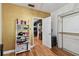 Additional bedroom featuring hardwood floors, decor, and an ensuite doorway at 125 E Grant St, Orlando, FL 32806