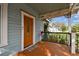 Close up of stained wooden porch with a decorative flamingo at 125 E Grant St, Orlando, FL 32806