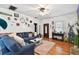 Comfortable living room featuring hardwood floors, decor, and a stylish blue sectional at 125 E Grant St, Orlando, FL 32806