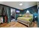 Stylish main bedroom with a decorative curtain, an ensuite, and a television at 125 E Grant St, Orlando, FL 32806