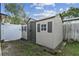 Backyard shed with dual doors and shuttered windows, plus a gated entrance at 125 E Grant St, Orlando, FL 32806